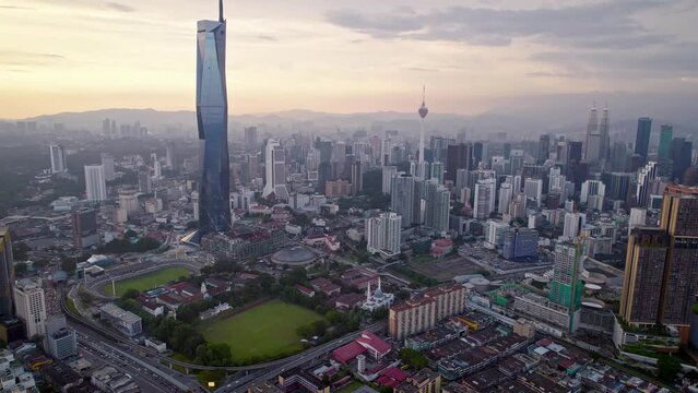 Kuala Lumpur city center with DJI Mavic Drone on beautiful Sunset: 
Petronas Twin Towers, Menara, Warisan, Merdeka skyline panorama, capital of Malaysia