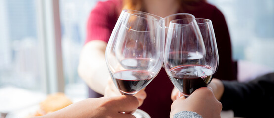 Closeup hands of team young business people in party celebrate success holding glass of wine cheer together at restaurant luxury, friendly and social colleague, meet friend and community concept.