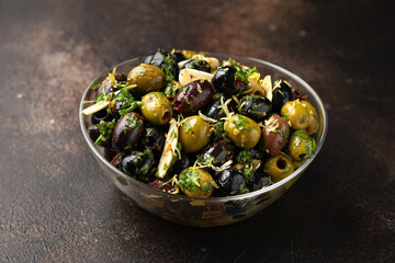 Marinated olives with fresh herbs, garlic, red wine vinegar and lemon zest