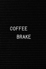 Vertical black spongy board with the text "coffee break" for background