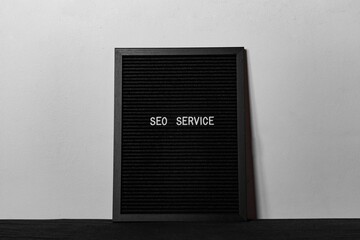 Black spongy board with the text "SEO service" for background