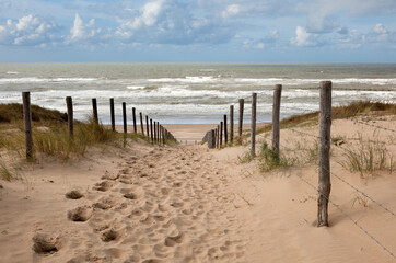 Sand dunes in Holland and a beach path to the North sea