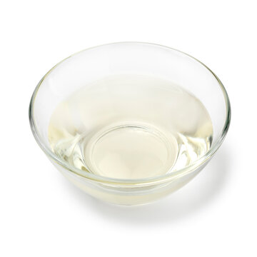 Glass bowl with Japanese mirin close up isolated on white background