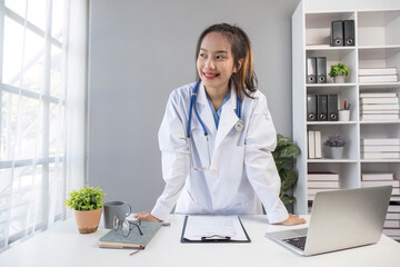 Young beautiful asian woman doctor smiling confident standing at clinic