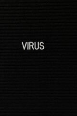 Vertical black spongy board with a text 