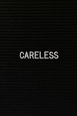 Depressing vertical background saying careless in white text over a black backdrop