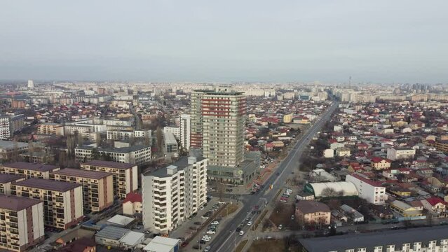 Aerial time lapse footage of Ploiesti city with modern buildings and cars in motion