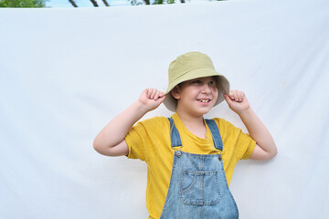 cheerful boy with a vibrant outfit signifies a fun and interactive educational setting, encouraging...