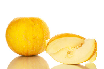 Naklejka na ściany i meble One yellow melon with one slice, macro, isolated on white background.