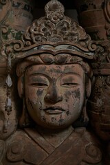 Fototapeta na wymiar Closeup shot of a large, ornate statue atop a rock pedestal at the entrance of Todaji Nara Temple