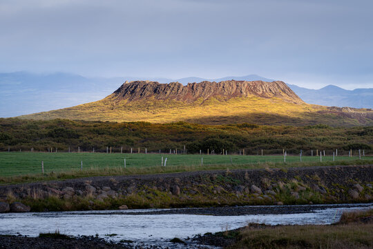 Eldborg crater in Iceland lit by morning sunlight. Perfectly shaped crater and hiking trail