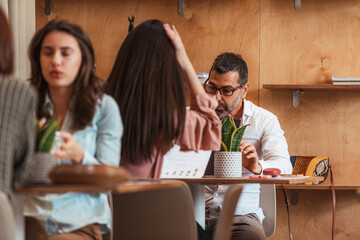 Senior man talking with his colleagues