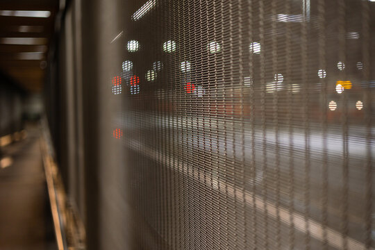 Closeup of the window shutters against the blurred city background