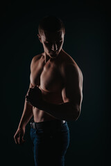 Fototapeta na wymiar Good-looking and muscular man flexing his muscles
