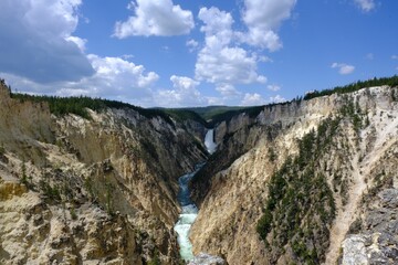 Stunning landscape of Yellowstone Falls cascading down from the rocky cliffs