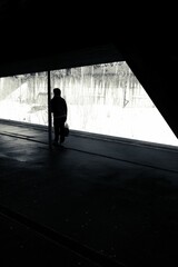 Man standing near a railway tracks and waiting for his train