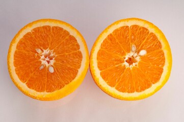 Closeup of oranges cut on a white background