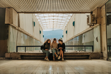Beautiful girls, best friends, reading a book together after school