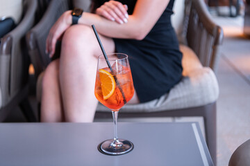 Aperol spritz cocktail. aperitif in the bar. summer refreshing cocktail. drinking lemonade. glass...