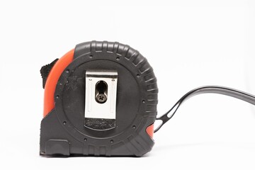 a metal and plastic tape measure with red ends on a white background