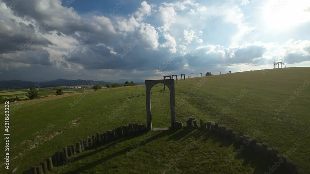 Poster Drone shot around Big cellar monument with green landscape of hills, Hungary