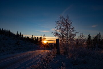 Idyllic winter morning with the sun rising above a picturesque landscape