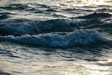 Idyllic scene of tranquil ocean waves illuminated by a golden sunset