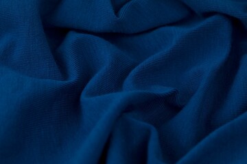 Close-up shot of a piece of light blue fabric with subtle highlights - obrazy, fototapety, plakaty