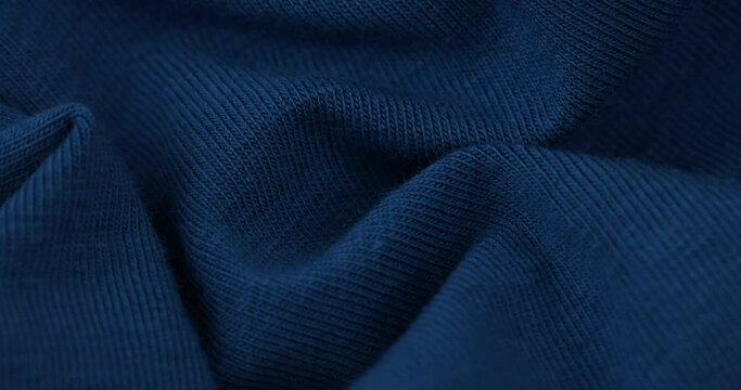 Closeup video of blue knitted fabric