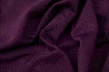 Closeup shot of dark purple fabric.