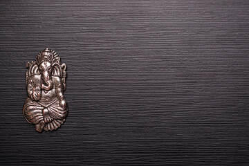 Top view of silver ganesh ornament with text space