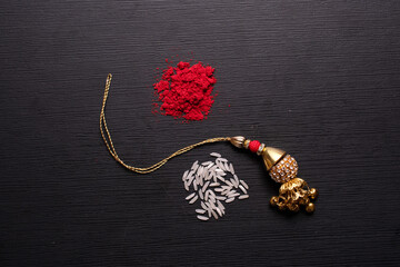 lumba rakhi on golden background