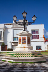 Historic street lamp on the square in port village of Tarifa, Spain.The