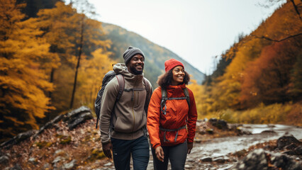 Young black couple hiking in the fall - Powered by Adobe