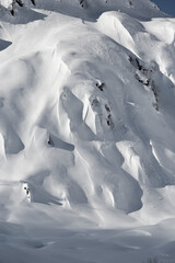 Fototapeta na wymiar Snow covered mountains with fresh snow in Tyrol in Austria. Skiing in backcountry powder snow