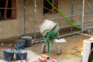 Mobile electric concrete mixer at construction site