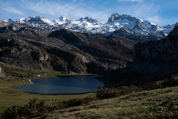 Naklejka na ściany i meble Panoramic view of mountains with a lake on the base