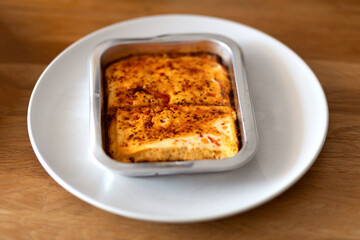 Baked cheese on the wood table