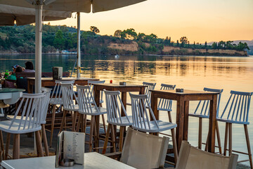 Tables with beautiful seaside view at Koroni in Messenia, Greece.
