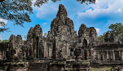 Fototapeta na wymiar Ancient ruins Thom Bayon temple - famous Cambodian landmark, Angkor Wat complex of temples. Siem Reap, Cambodia.