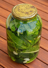 Big jar of pickled cucumbers.