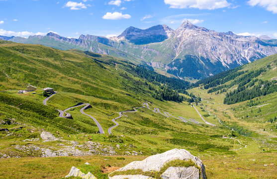 Landscape panoramic view of Splugen mountain pass in Switzerland and its alpine road with tight serpentines.