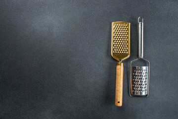 metal grater with a wooden handle, vertical image. top view. place for text
