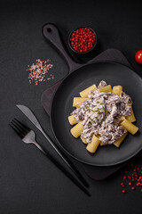 Delicious fresh pasta with champignon mushrooms in a creamy sauce