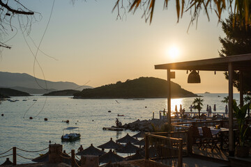 An island in the bay of Ksamil Albania by sunset.