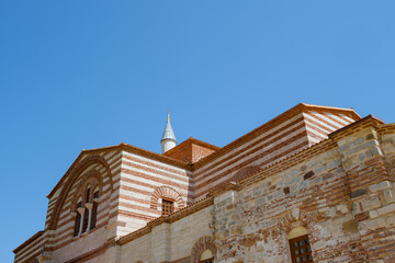 Hagia Sophia in Enez Edirne. The medieval church (now mosque) is in the front and the new minaret is in the background.