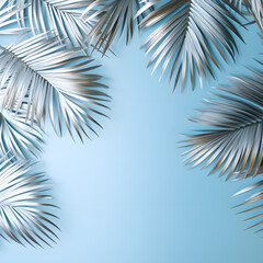 frame of silver palm branches on a pastel blue background. Minimal summer and sea concept