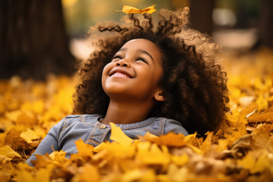 Smiling Child With Afro Hair In Autumn Season Leaves, Multicultural Diverse Portrait