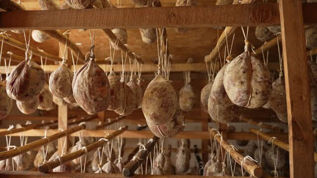 Cooking meat hung on a rope