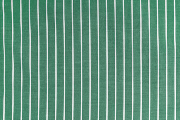 Striped green white fabric texture background wtih copy space. Shirt fabric, tablecloth textile,...
